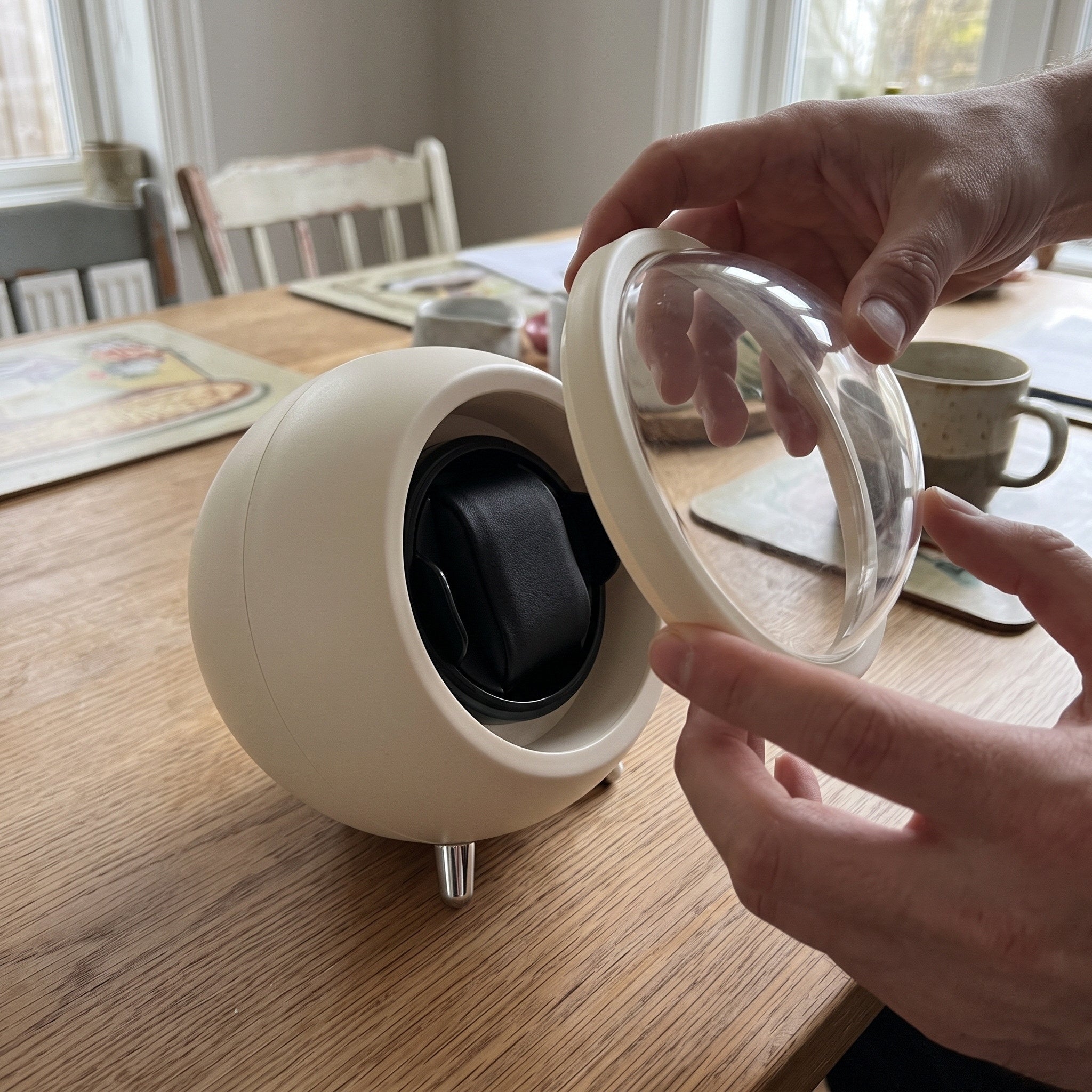 Hands removing the clear dome from an Cream winder